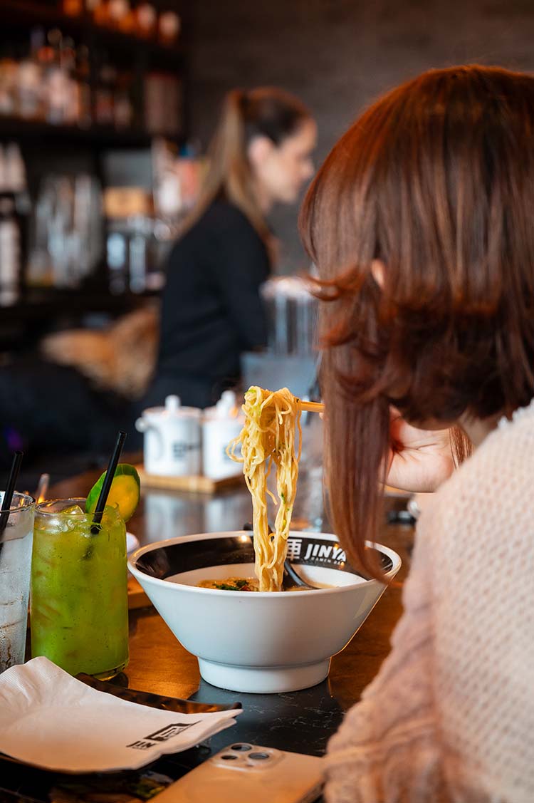 customer eating at Jinya Ramen Bar